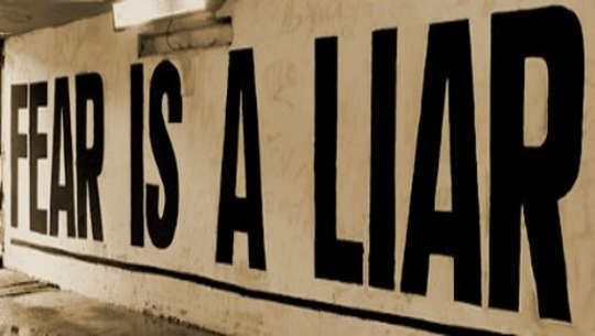 It's Your Choice: God of Fear or God of Love billboard reading: fear is a liar