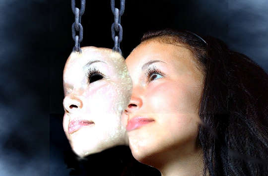 From Misery to Splendor: Restoring Relationships a mask held up by chains overlapping a woman's face