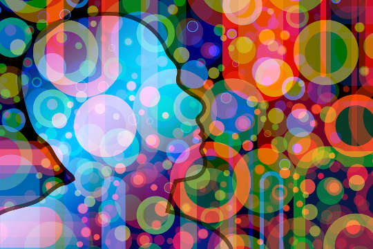 The Principle of Resonance: Energies, Vibrations and Rhythm an outline of a human head with numerous circles of various colors and light around it