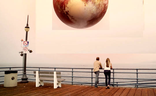 Pluto in Aquarius: Transforming Society, Empowering Progress couple looking out at a hugely enlarged sphere of Pluto