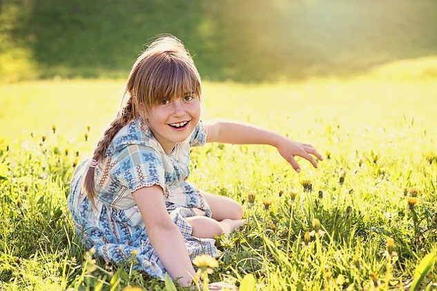 Rising Out of Suffering and Fear: The Freedom to Choose Love radiant young girl in an equally radiant meadow