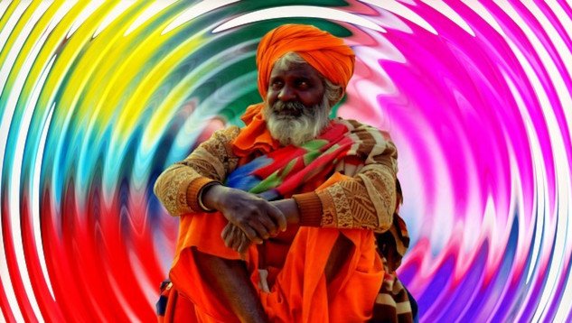 Being Here Now: Lessons from Spiritual Encounters a sadhu sitting radiating energy all around him