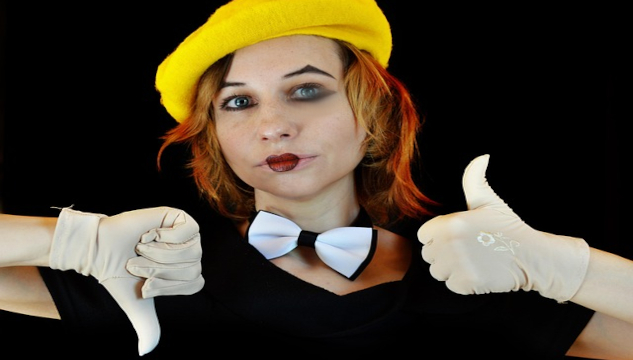 Image of a girl with clown face with one hand in a thumbs up, the other thumbs down. Image by Victoria from Pixabay.&nbsp;