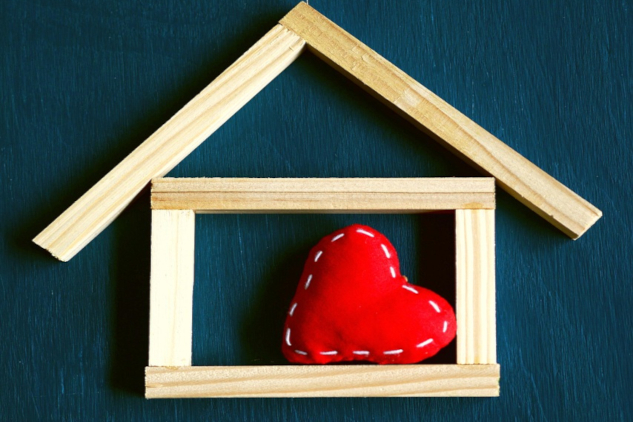 A drawing of a shiny red heart inside the outlines of a little house. Image by congerdesign from Pixabay.&nbsp;