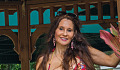 woman with long beautiful hair standing in a gazebo